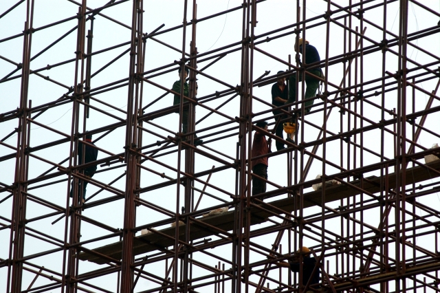 people working in constructin a building